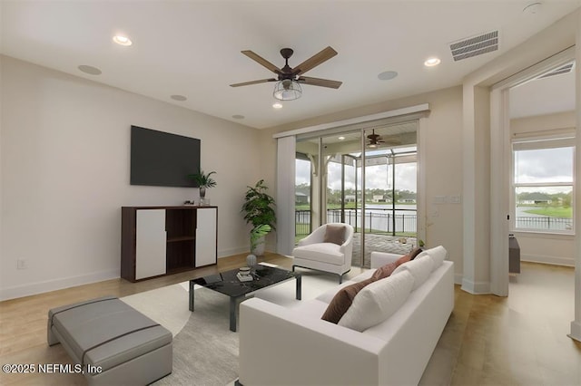 85212 Champlain Dr, Fernandina Beach, FL 32034 - living area featuring ceiling fan, healthy amount of natural light, light wood-style flooring, and recessed lighting