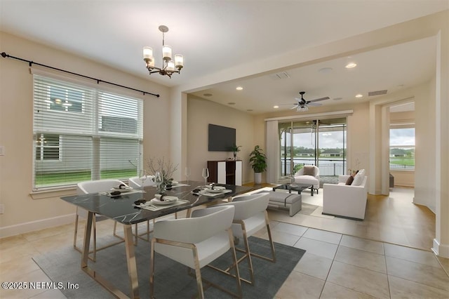 85212 Champlain Dr, Fernandina Beach, FL 32034 - dining area with a chandelier, light tile patterned floors, ceiling fan, and recessed lighting