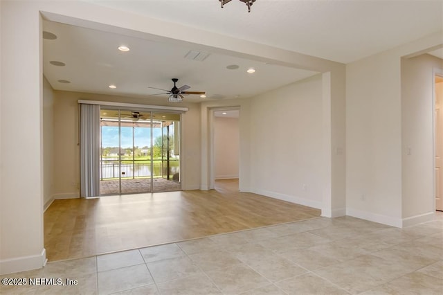 85212 Champlain Dr, Fernandina Beach, FL 32034 - spare room with recessed lighting, light tile patterned floors, a ceiling fan, and a water view