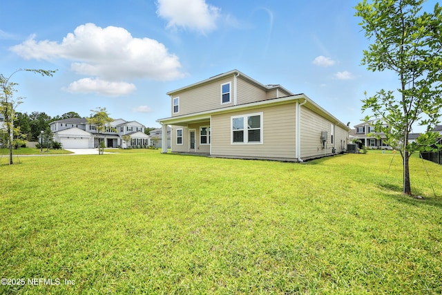 24 Tradesman Ln, Saint Johns, FL 32259 - back of house featuring a lawn and a garage