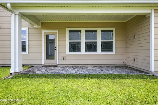 24 Tradesman Ln, Saint Johns, FL 32259 - entrance to property with a lawn and a patio