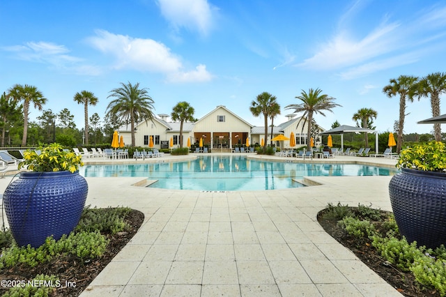 24 Tradesman Ln, Saint Johns, FL 32259 - community pool with a patio