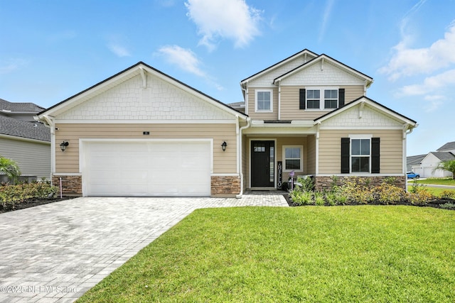24 Tradesman Ln, Saint Johns, FL 32259 - craftsman inspired home featuring stone siding, decorative driveway, a front lawn, and a garage