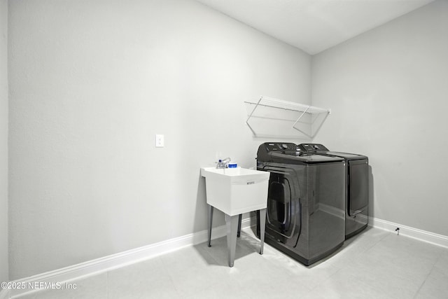 24 Tradesman Ln, Saint Johns, FL 32259 - laundry area with independent washer and dryer and light tile patterned floors