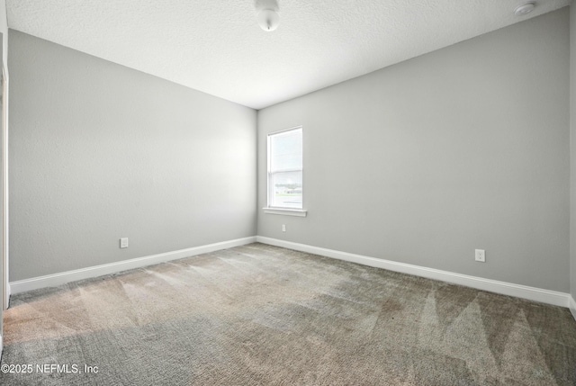 24 Tradesman Ln, Saint Johns, FL 32259 - unfurnished room with a smoke detector, carpet floors, and a textured ceiling