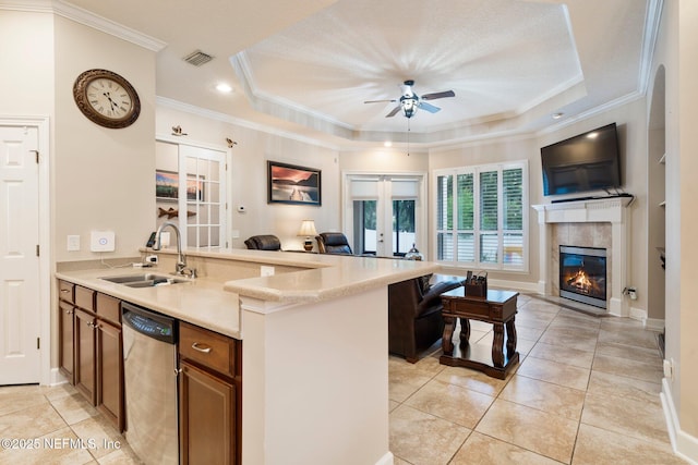 2025 Castle Point Ct, Fleming Island, FL 32003 - kitchen featuring open floor plan, dishwasher, french doors, brown cabinetry, and ornamental molding
