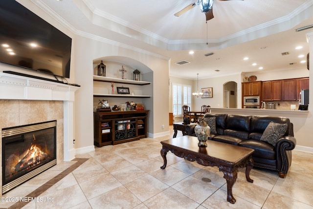 2025 Castle Point Ct, Fleming Island, FL 32003 - living room featuring a ceiling fan, ornamental molding, light tile patterned floors, a tile fireplace, and recessed lighting