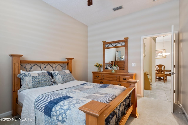 2025 Castle Point Ct, Fleming Island, FL 32003 - bedroom with a chandelier, vaulted ceiling, light colored carpet, ceiling fan, and light tile patterned flooring