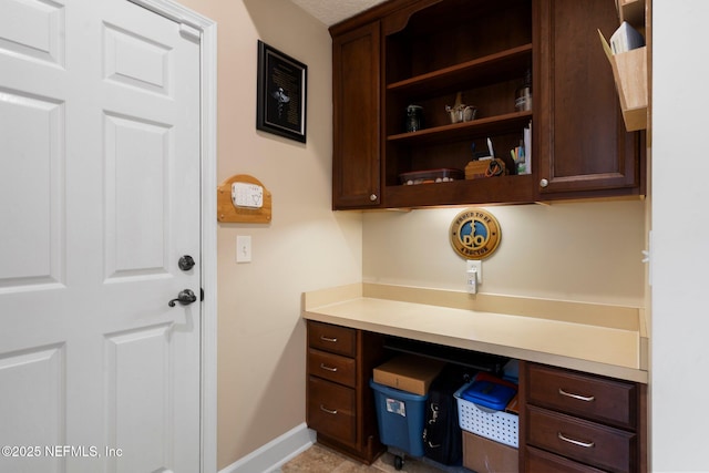 2025 Castle Point Ct, Fleming Island, FL 32003 - office featuring built in desk and baseboards