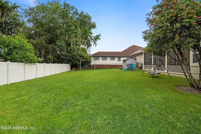 2025 Castle Point Ct, Fleming Island, FL 32003 - fenced backyard with a playground