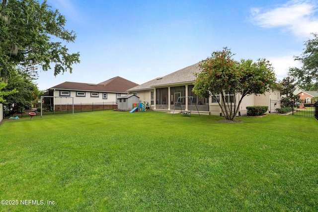 2025 Castle Point Ct, Fleming Island, FL 32003 - fenced backyard with a sunroom and a playground