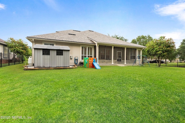 2025 Castle Point Ct, Fleming Island, FL 32003 - rear view of property with a sunroom, a fenced backyard, and a shingled roof