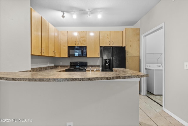12700 Bartram Park Blvd Unit 1923, Jacksonville, FL 32258 - kitchen with black appliances, washer / dryer, a peninsula, light tile patterned floors, and light brown cabinetry