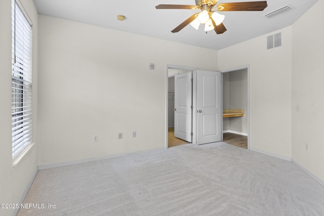 12700 Bartram Park Blvd Unit 1923, Jacksonville, FL 32258 - unfurnished bedroom with carpet, multiple windows, a spacious closet, and connected bathroom