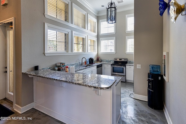 12700 Bartram Park Blvd Unit 1923, Jacksonville, FL 32258 - kitchen with appliances with stainless steel finishes, crown molding, a peninsula, light stone countertops, and a breakfast bar