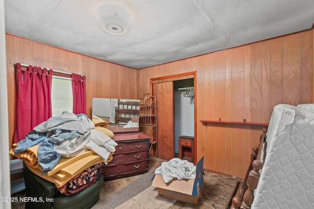 44125 Jarrett Rd, Callahan, FL 32011 - carpeted bedroom featuring wood walls and a closet