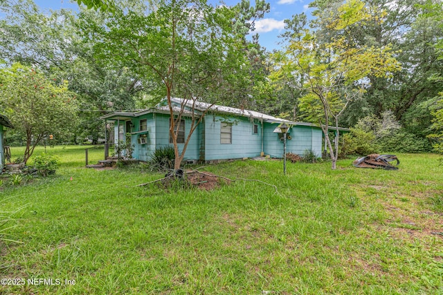 44125 Jarrett Rd, Callahan, FL 32011 - view of home's exterior featuring a lawn