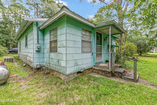 44125 Jarrett Rd, Callahan, FL 32011 - view of property exterior featuring a yard and a central air condition unit