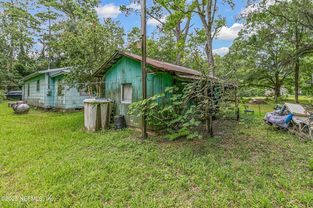 44125 Jarrett Rd, Callahan, FL 32011 - view of home's exterior with a lawn