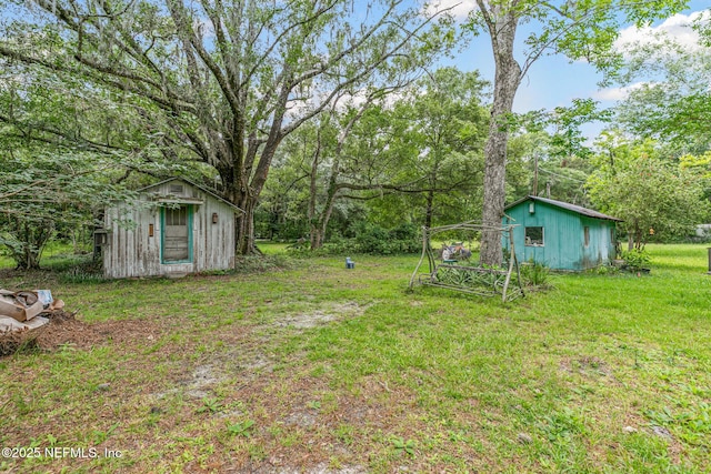 44125 Jarrett Rd, Callahan, FL 32011 - view of green lawn featuring a storage unit