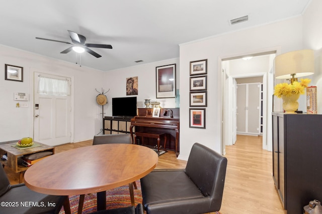 3207 Plum St, Jacksonville, FL 32205 - dining room with a ceiling fan, light wood-type flooring, and ornamental molding