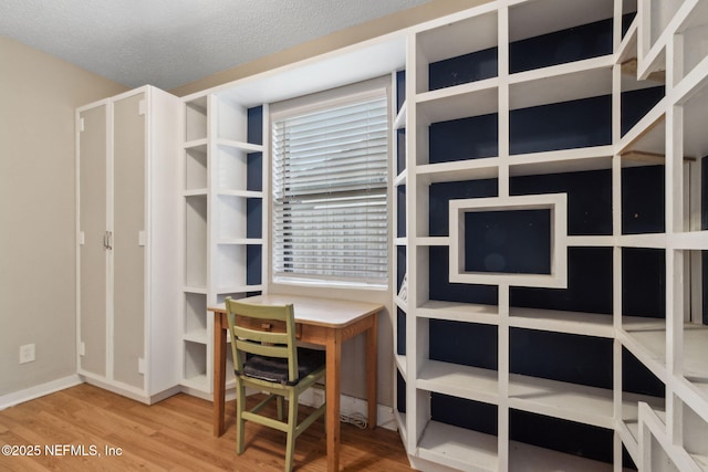 3207 Plum St, Jacksonville, FL 32205 - home office featuring wood finished floors and a textured ceiling