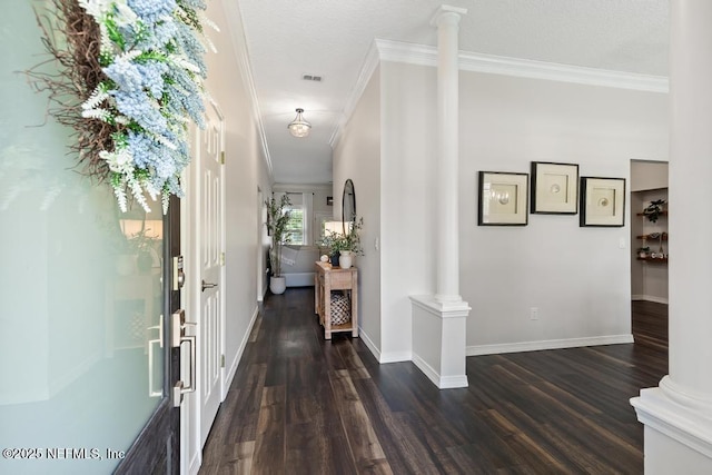 44677 Green Meadows Ln, Callahan, FL 32011 - entryway with ornate columns, crown molding, and dark wood-type flooring