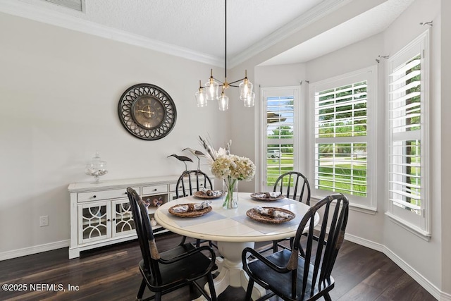 44677 Green Meadows Ln, Callahan, FL 32011 - dining space featuring dark wood-style flooring, ornamental molding, and a textured ceiling