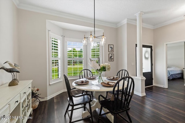 44677 Green Meadows Ln, Callahan, FL 32011 - dining area with dark wood-style flooring, ornate columns, ornamental molding, a chandelier, and a textured ceiling
