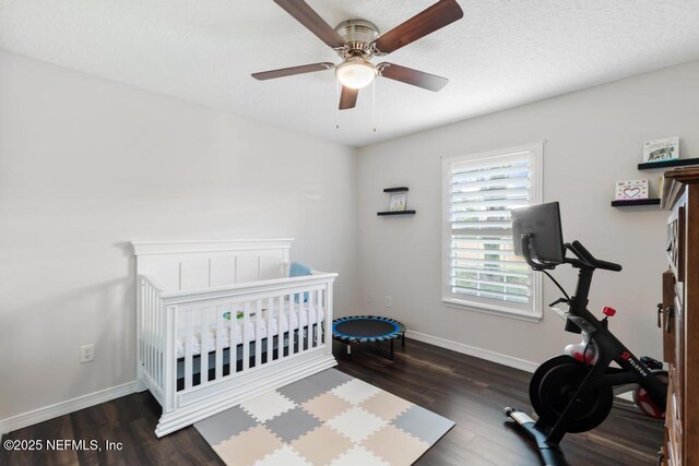 44677 Green Meadows Ln, Callahan, FL 32011 - bedroom with wood finished floors, a crib, and a ceiling fan