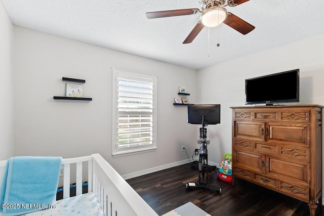 44677 Green Meadows Ln, Callahan, FL 32011 - bedroom featuring wood finished floors, a ceiling fan, and a textured ceiling