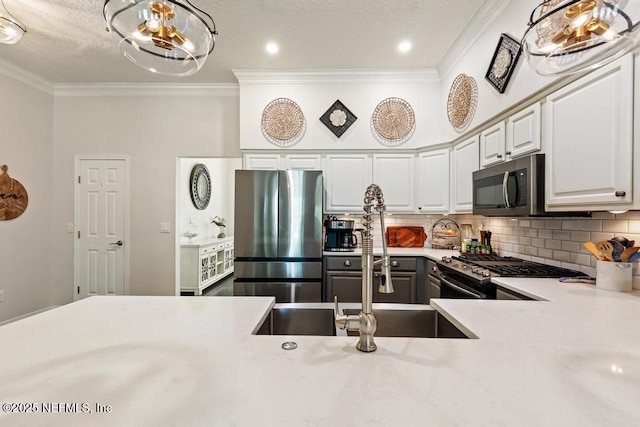 44677 Green Meadows Ln, Callahan, FL 32011 - kitchen with stainless steel appliances, light countertops, ornamental molding, decorative backsplash, and a chandelier