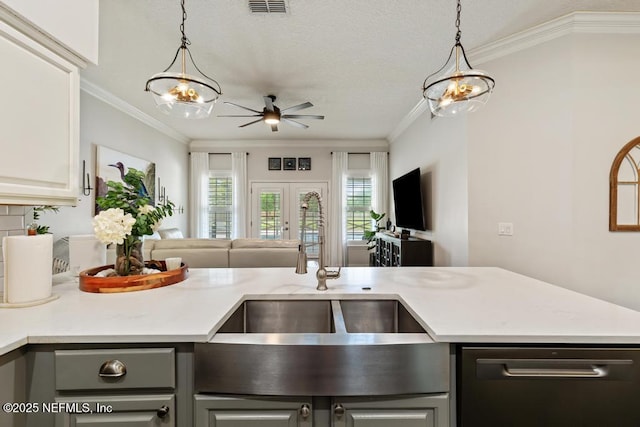 44677 Green Meadows Ln, Callahan, FL 32011 - kitchen featuring open floor plan, ceiling fan, light countertops, decorative light fixtures, and crown molding