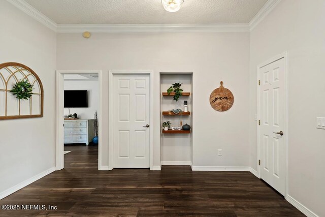 44677 Green Meadows Ln, Callahan, FL 32011 - spare room with dark wood-style floors, crown molding, and a textured ceiling
