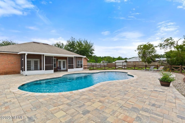 44677 Green Meadows Ln, Callahan, FL 32011 - view of pool with french doors, a sunroom, a patio, and a fenced backyard