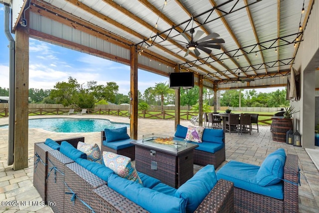 44677 Green Meadows Ln, Callahan, FL 32011 - fenced backyard with outdoor lounge area, ceiling fan, outdoor dining space, and a patio area