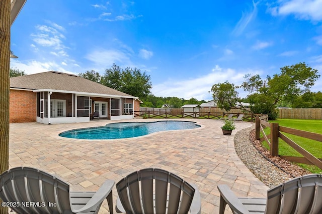 44677 Green Meadows Ln, Callahan, FL 32011 - view of pool featuring french doors, a sunroom, a patio, and a fenced backyard