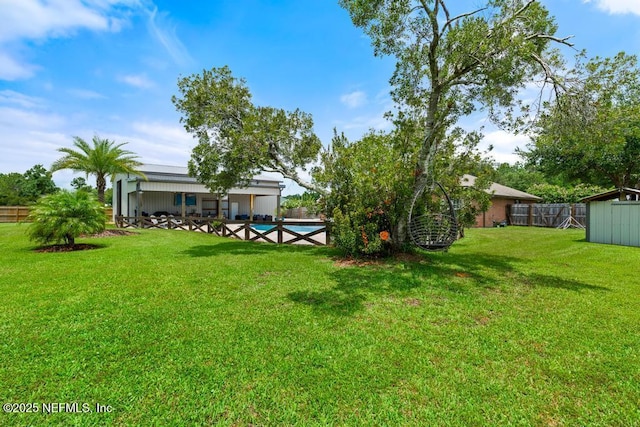 44677 Green Meadows Ln, Callahan, FL 32011 - fenced backyard featuring a pool and a shed