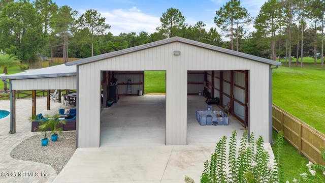 44677 Green Meadows Ln, Callahan, FL 32011 - detached garage with view of wooded area
