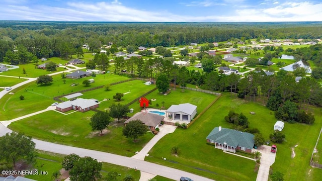 44677 Green Meadows Ln, Callahan, FL 32011 - aerial perspective of suburban area featuring a heavily wooded area