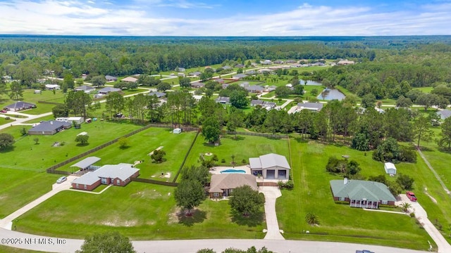 44677 Green Meadows Ln, Callahan, FL 32011 - aerial view of residential area with a heavily wooded area