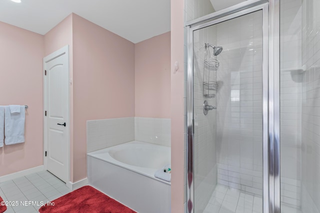 945 Registry Blvd Unit 312, Saint Augustine, FL 32092 - full bathroom featuring a garden tub, a shower stall, and tile patterned floors