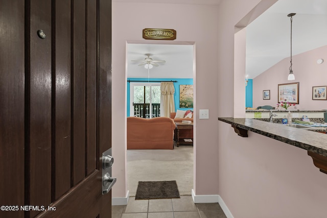 945 Registry Blvd Unit 312, Saint Augustine, FL 32092 - foyer entrance featuring a ceiling fan, light tile patterned floors, and light carpet