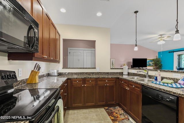 945 Registry Blvd Unit 312, Saint Augustine, FL 32092 - kitchen featuring black appliances, ceiling fan, dark stone countertops, lofted ceiling, and hanging light fixtures