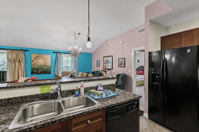 945 Registry Blvd Unit 312, Saint Augustine, FL 32092 - kitchen with black appliances, open floor plan, vaulted ceiling, a chandelier, and decorative light fixtures