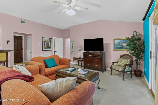 945 Registry Blvd Unit 312, Saint Augustine, FL 32092 - living room featuring a ceiling fan, lofted ceiling, and light colored carpet