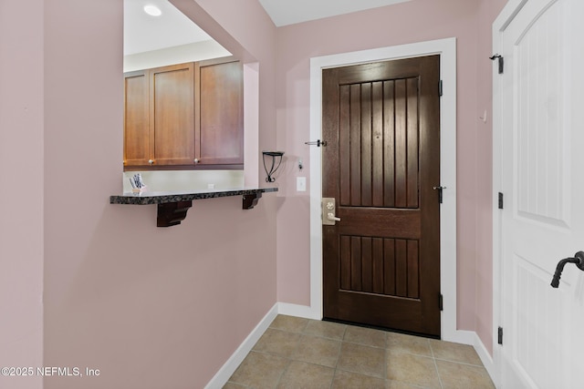 945 Registry Blvd Unit 312, Saint Augustine, FL 32092 - doorway to outside featuring baseboards and light tile patterned floors