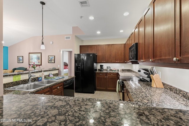 945 Registry Blvd Unit 312, Saint Augustine, FL 32092 - kitchen with black appliances, hanging light fixtures, light tile patterned flooring, dark stone countertops, and vaulted ceiling