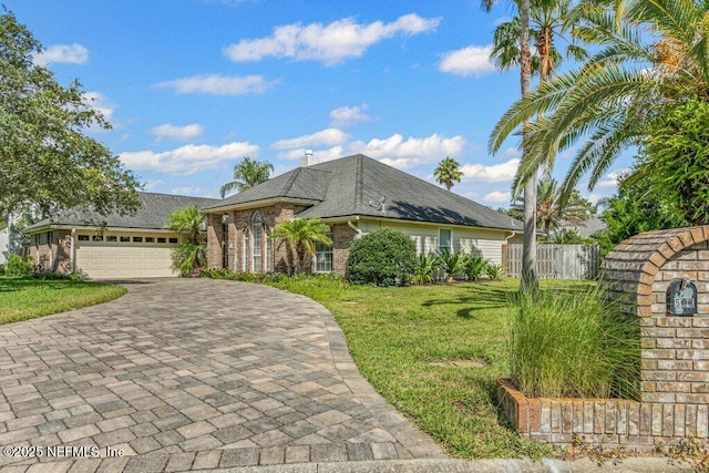 508 Lighthouse Ct, Neptune Beach, FL 32266 - view of front of home featuring decorative driveway, a garage, brick siding, and a shingled roof