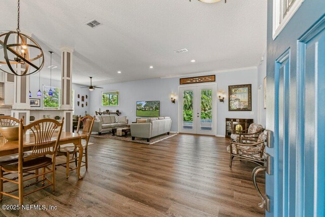 508 Lighthouse Ct, Neptune Beach, FL 32266 - dining space with wood finished floors, french doors, recessed lighting, a ceiling fan, and a chandelier